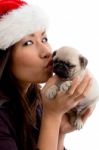 Female With Hat And Kissing Puppy Stock Photo