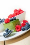 Green Tea Matcha Mousse Cake With Berries Stock Photo