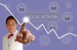 Businessman Pushing Social Network Button Stock Photo