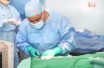 Doctor Using Tools In A Surgery Stock Photo