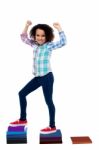 Active Girl Kid Climbing On Notebooks Stock Photo