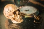 Skull And Old Stopwatch Stock Photo