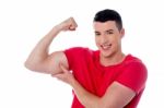 Fitness Man Showing Bicep Muscles Stock Photo