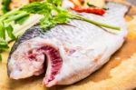 Fish On Chopping Block Stock Photo