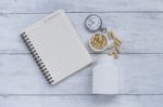 Blank Notebook And Herb Capsule With Vintage Watch And Plastic Container Stock Photo