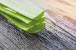 Aloe Vera Leaves On Wooden Stock Photo