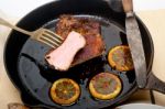 Pork Chop Seared On Iron Skillet Stock Photo