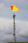 Flare Stack At Oil And Gas Refinery Plant Stock Photo