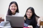 Two Asia Thai High School Student Uniform Best Friends Beautiful Girl Using Her Laptop Stock Photo