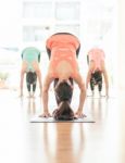 Asian Woman Doing Yoga Indoors Stock Photo