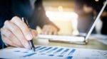 Working Process Startup. Businessman Working At The Wood Table W Stock Photo