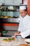 Chef Busy In Preparing Pizza Stock Photo