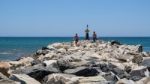 Cabo Pino, Andalucia/spain - July 2 : People Exploring The Rocks Stock Photo