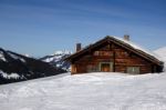 An Old Mountain Shelter House Covered With Lots Of Snow Stock Photo