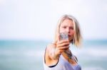 Beautiful Young Blonde Woman Posing Outdoor At The Rocky Sea Sho Stock Photo