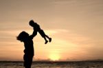 Mommy With Her Child At Beach Stock Photo