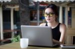 Portrait Of Thai Adult Student University Beautiful Girl Using Her Laptop Stock Photo