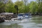 Tourist Boats Moored On River Thames Near Eton Bridge Stock Photo