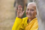 An Unidentified Old Buddhist Female Monk Dressed In Yellow Toga Stock Photo