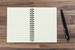 Notebook With Pen Stock Photo