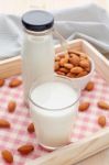 Almond Milk In Glass And Bottle With Almonds Stock Photo