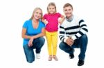 Studio Portrait Of Charming Young Family Stock Photo