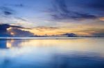 Dramatic  Beach  Sunset With Colorful Sky Background Stock Photo