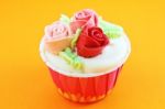 Cup Cake With Cream Rose Flower Stock Photo