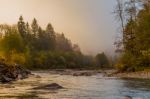 Misty River In The Alps Stock Photo