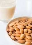 Almond Milk And Grain On White Kitchen Table Stock Photo