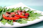 Salad With Fresh Tomatoes, Capers And Arugula Stock Photo