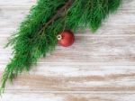 Christmas Fir Tree With Decoration On Dark Wooden Board Stock Photo