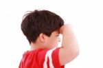 Boy Intently Looking Far Away Stock Photo