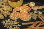 Dried Herbs And Ginseng, Top View Of Thai Herbs And Ginseng On Wooden Floor Stock Photo