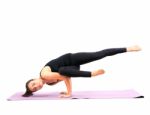 Portrait Of Asian Woman Wearing Black Body Suit Sitting In Yoga Meditation Position Isolated White Background Stock Photo