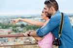 Young Tourist Couple Looking At The Views In The City Stock Photo