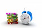 Alarm Clock Near Stack Of Books Stock Photo