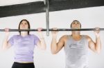 Friends Taking Pull Ups Stock Photo