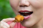 Woman Is Eating Fried Chicken Stock Photo