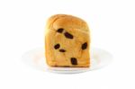 Front Of Bread With Raisin Dish On White Background Stock Photo