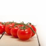 Fresh Cherry Tomatoes On A Cluster Stock Photo