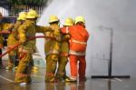 Fireman. Firefighters Fighting Fire During Training Stock Photo