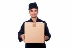 Young Boy Delivering Parcel Safely Stock Photo