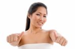 Young Woman In Towel Showing Thumb Up Stock Photo