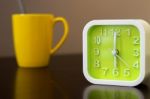 Coffee Time On Morning Before Going Work. Green Alarm Clock With Stock Photo