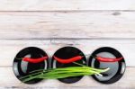 Red Hot Chilli Pepper And Scallions On Plate Stock Photo