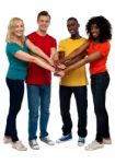 Smiling Friends Joining Hands Stock Photo