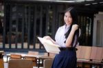 Asia Thai High School Student Uniform Beautiful Girl Read A Book Stock Photo