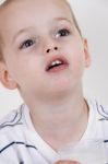 Little Child Looking Upward Stock Photo