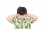 Boy Closing His Eyes And Ears Stock Photo